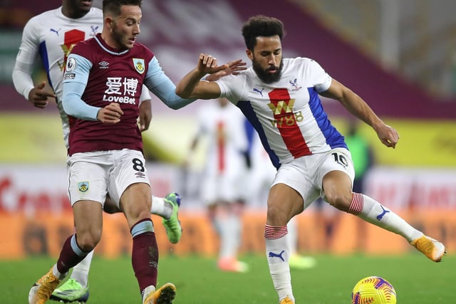 Andros Townsend of Crystal Palace is challenged by Josh Brownhill of Burnley during the Premier League match between Burnley and Crystal Palace at Turf Moor on November 23, 2020 in Burnley, England.