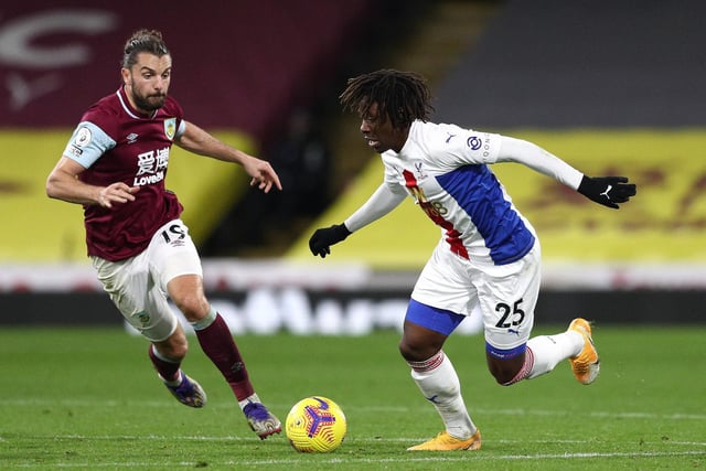 Eberechi Eze of Crystal Palace is challenged by runs away from Jay Rodriguez of Burnley during the Premier League match between Burnley and Crystal Palace at Turf Moor on November 23, 2020 in Burnley, England.