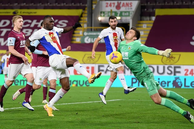 Nick Pope of Burnley saves from Christian Benteke of Crystal Palace during the Premier League match between Burnley and Crystal Palace at Turf Moor on November 23, 2020 in Burnley, England.
