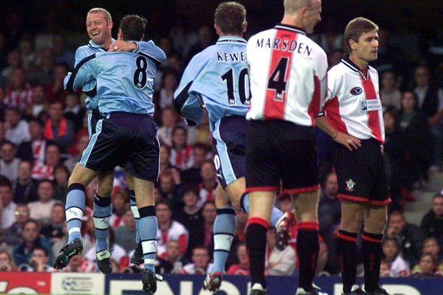 Michael Bridges celebrates scoring one of his three goals against Southampton at The Dell with David Batty in August 1999.