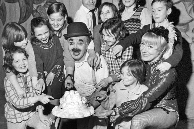 Children of the Women's Circle meet Charlie Cairoli at Leeds City Varieties during a production of the pantomime Jack and the Beanstalk in January 1973. Also pictured is Ann Langford.