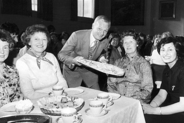 Are You Being Served? actor Jon Inman joined Women's Circle members for tea at the Grand Theatre in June 1979. He was appearing in Charley's Aunt at the theatre. He is pictured ready to serve Dorothy Webster with a sandwich on her 68th birthday.