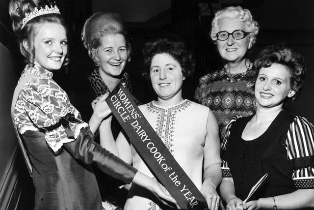 October, 1972 and Cynthia Chandler (centre), was winner of the Women's Circle Dairy Cook of the Year contest. She is pictured receiving her award from Karen Longstaff, Dairy Queen for England and Wales, watched by runners-up Karin Campbell, Eva Heeley and Nell Waterhouse.