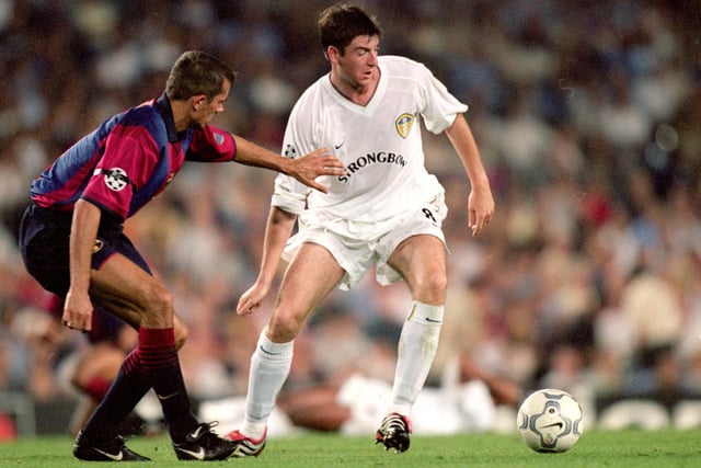 Michael Bridges holds off Barcelona's Phillip Cocu during the Champions League clash at the Nou Camp in September 2000.