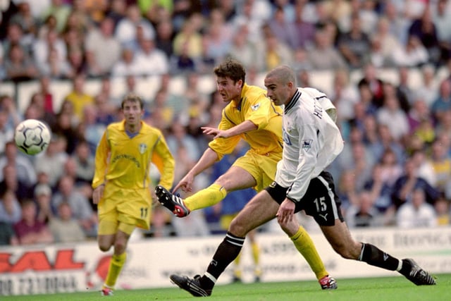 Michael Bridges shoots at goal as Derby County's Danny Higginbotham looks on during the FA Carling Premiership match at Pride Park in September 2000.