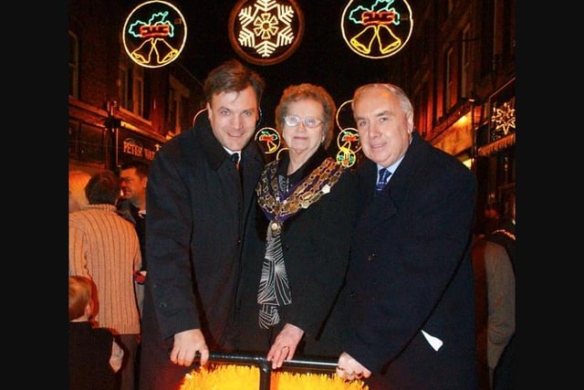 Ed Balls, Coun Margaret Pratt and Town Council Leader Barrie Smith pushing the plunger for Normanton's Christmas lights switch on in 2004.