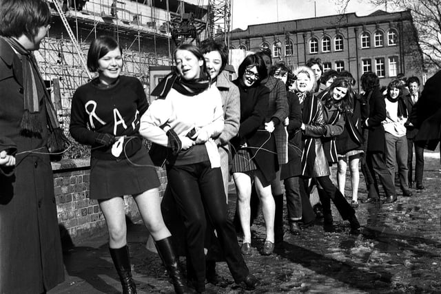 RETRO 1970 - Wigan Technical College students parade the town centre streets, attached to each other during Rag Week, collecting funds for local charities.