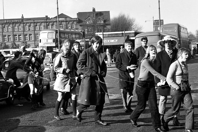 RETRO 1970 - Wigan Technical College students parade the town centre streets, attached to each other during Rag Week, collecting funds for local charities.