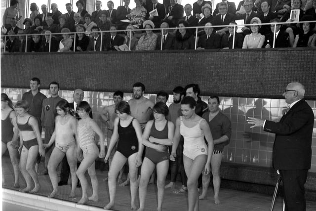 Swimmers get ready to jump into the pool at the official opening of The Urban District Council of Hindley new swimming pool, 18th March 1970.