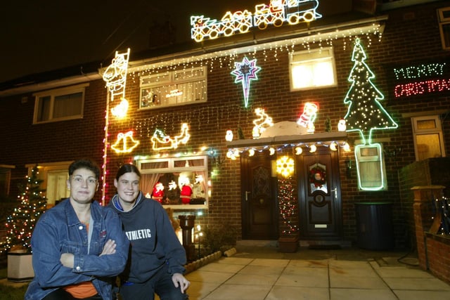 Thelma Sykes and daughter Nicola with their festive Elland home back in 2003.
