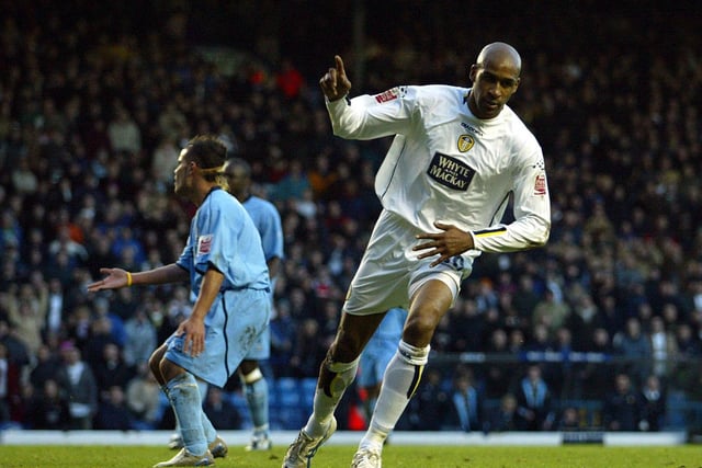 Brian Deane celebrates after scoring his second goal to put Leeds 4-1 up.