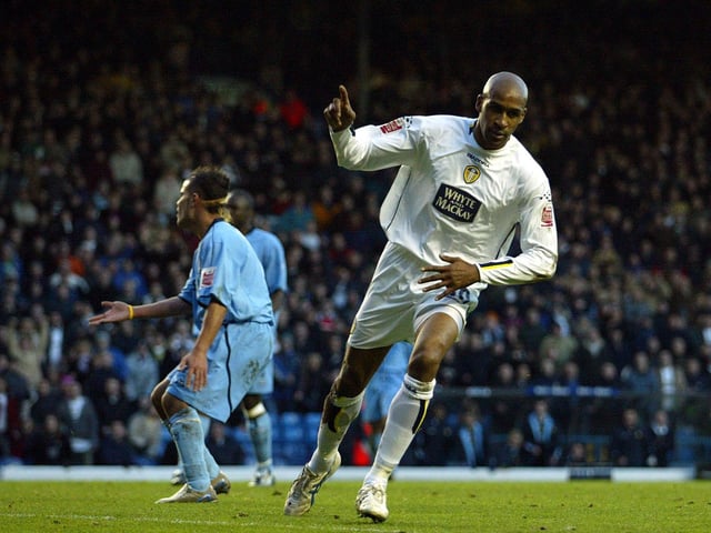 Brian Deane celebrates after scoring his second goal to put Leeds 4-1 up.