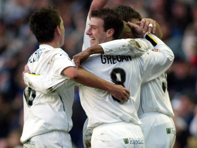 Brian Deane celebrates his hat-trick with teammates just before half-time.