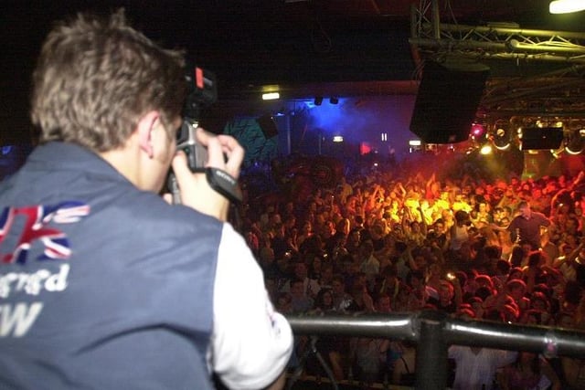 A cameraman from UK Uncovered in action at Tokyo Jos nightclub in August 2000