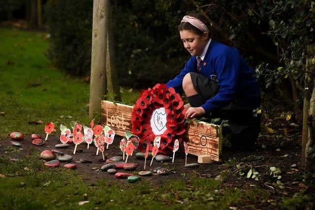 Pupils from Blackpool's Gateway Academy have set up a remembrance area in the playground.  Pictured is 10-year-old Darcy Mckenna.