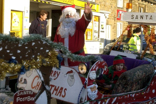 This picture from 2006 shows Father Christmas being pulled round the Market Place at Masham Victorian Fair.