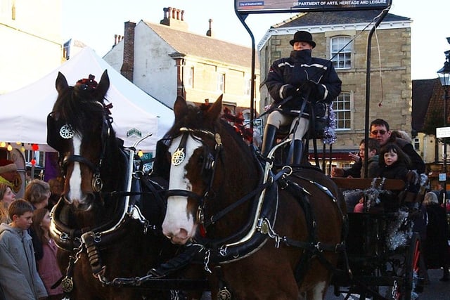 Visitors ride on a horse-drawn cart at the Wetherby Lions Dickension Market back in 2006.