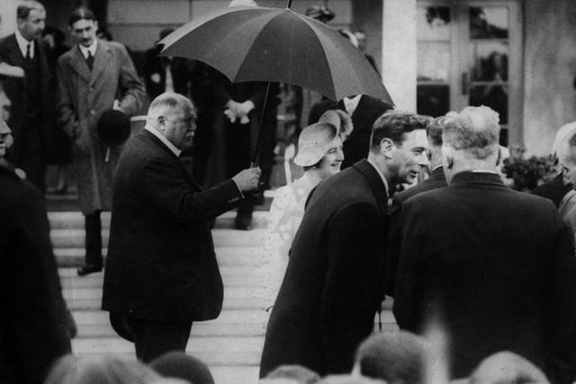 King George VI and Queen Elizabeth (later the Queen Mother) paid a visit to the hall in 1938, where they met local ex-servicemen. Lord Derby can be seen holding an umbrella over the Queen