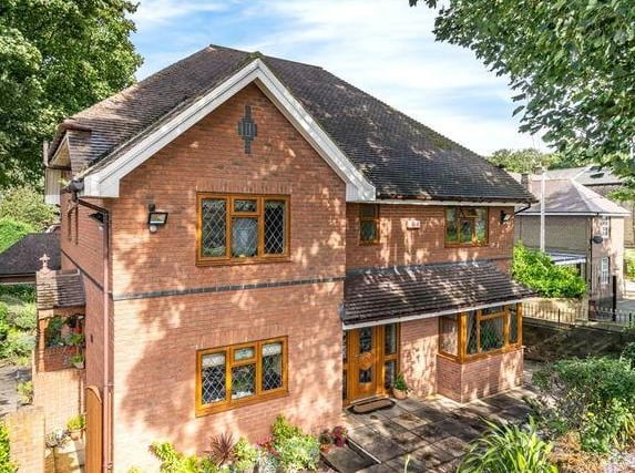 This detached home on Rooms Lane is perfect for a large family with five bedrooms, five bathrooms and three reception rooms. If that isn't enough it also has its own private swimming pool, games room and a sauna.