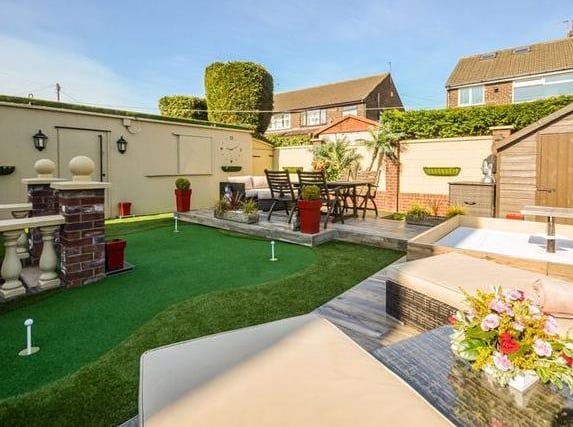 Bi folding doors lead out to the well maintained garden with a patio area, small lawn and decking area. It is on the market with £499,995 with New Home Agents.