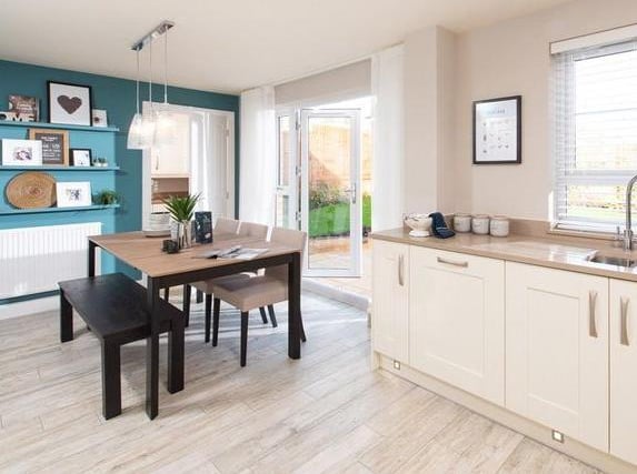 The kitchen has French doors which lead out into the garden. The house is on the market with Barratt Homes for £329,995 by appointment. (CGI showroom image).