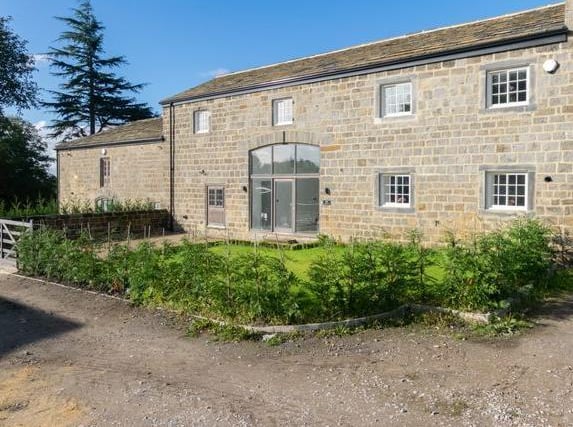 This Grade II listed barn conversion is in the Shadwell Grange Farm estate. It retains its period features such as exposed beams but has been completely renovated inside.