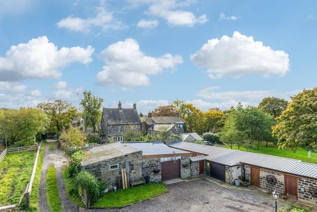 It also boasts an enclosed courtyard with stables, workshops, garages and it's own personal pub. It is on the market with Dacre Son & Hartley for £475,000.
