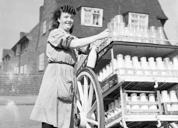 Circa 1942. This photo shows Ada Stone smiling for the camera whilst on her milk round, somewhere in Leeds during the Second World War.