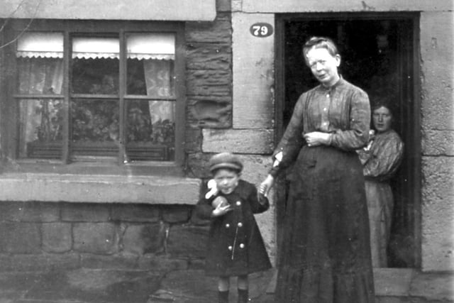 1900s. In this view two women and a child stand in front of the entrance of a house in West Ardsley. But where is the exact location?