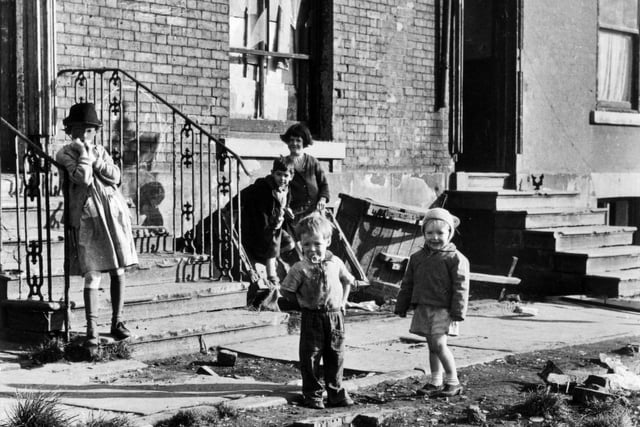 1970s. This view shows children playing outside in a condemned street in the Woodhouse area, due to be demolished prior to the construction of the Inner Ring Road.