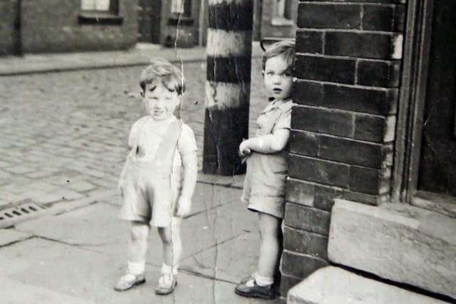 Undated. Photograph shows two small boys, Martin Bridge, aged about 3 and Robert Bridge (who supplied the image) aged about 2, possibly taken on the corner of Whingate Road and Albany Street in LS12.