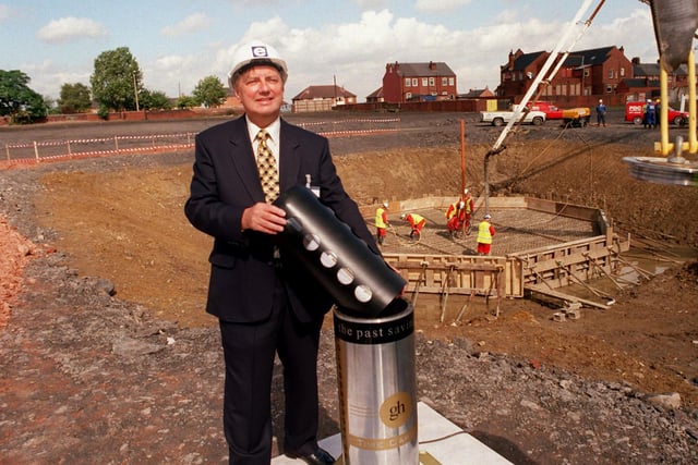 Coun Colin Croxall, leader of Wakefield Council, puts atime capsule filled with artefacts and memorabilia about the Glasshoughton Colliery and it's history into a cylinder which was to be buried in one of the last mineshafts.