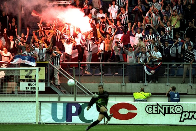 September 1999 and Partizan Belgrade fans celebrate as Nigel Martyn takes a goalkick during the UEFA Cup first round first leg at the Abe Lenstra Stadium in Heerenveen. Leeds won 3-1.