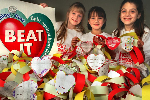 Children at St. Mary's C of E School were making yards of paper chains with motifs supporting the YEP Beat It Appeal. Pictured, from left, are Grace Harrison, Lorna Shields and Katie Francis, all aged eight.