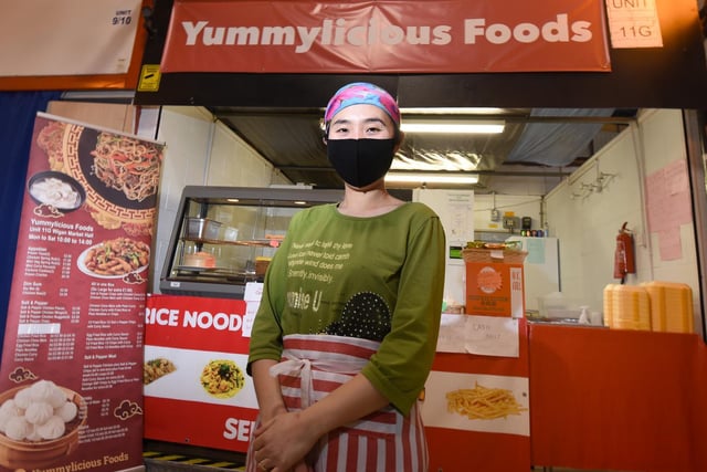 Hla Yin at Yummylicious Foods takeaway stall in Wigan Indoor Market.