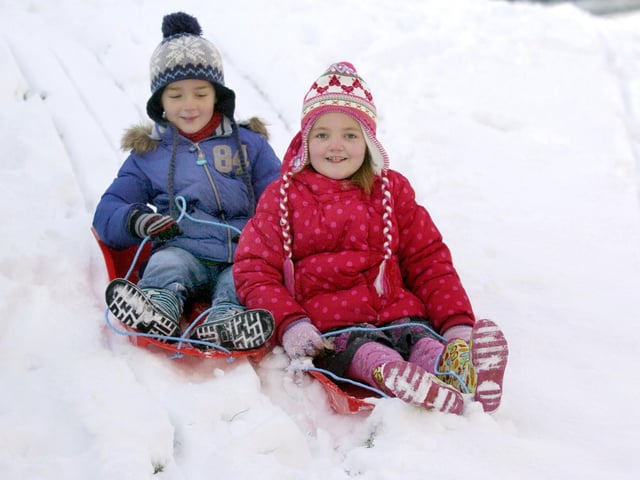 Liam Oglesby and big sister Lauren have fun sledging in East Ayton as winter takes a grip in Scarborough.
