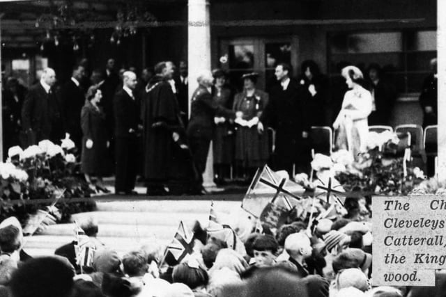 Queen Elizabeth, pictured outside the Marine Hall during a visit to Fleetwood in 1938. Her husband, King George VI is standing on her right. The couple were on a tour of Lancashire at the time.