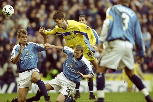 Eirik Bakke is stopped by Manchester City's Richard Jobson and Tony Grant during the FA Cup fourth round clash at Maine Road in January 2000. Leeds won 5-2.
