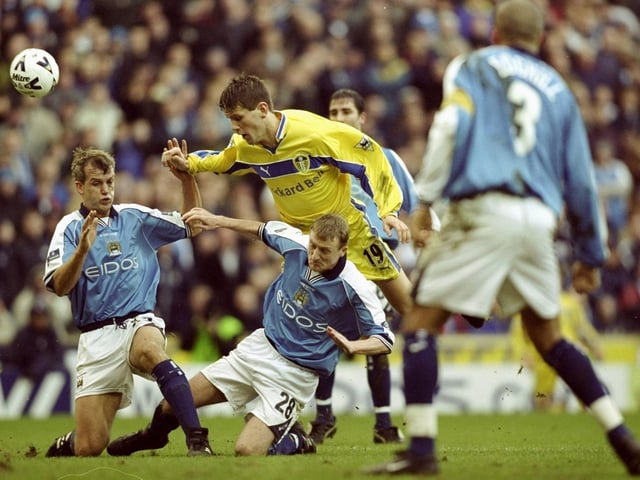 Eirik Bakke is stopped by Manchester City's Richard Jobson and Tony Grant during the FA Cup fourth round clash at Maine Road in January 2000. Leeds won 5-2.