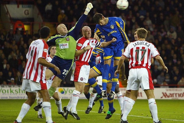 Eirik Bakke goes for a high ball with Sheffield United goalkeeper Paddy Kenny during the Worthington Cup third round clash at Bramall Lane in November 2002. The Whites lost 2-1.