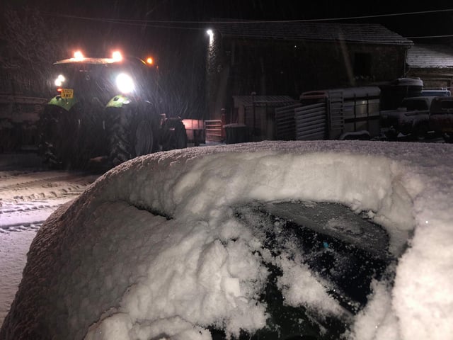 Several inches of snow quickly fell overnight, burying cars and coating country roads