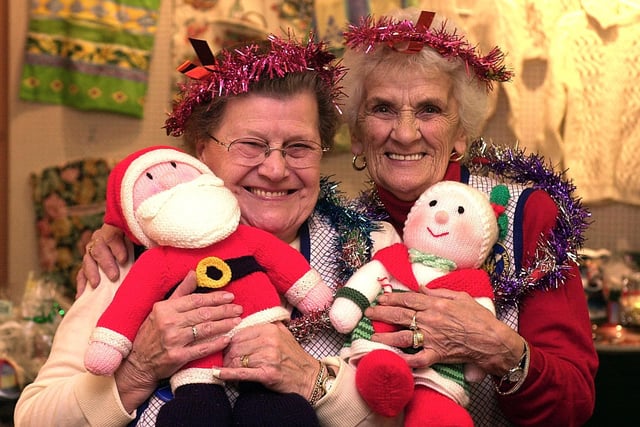 Joan and Min with their cuddly dolls at the Prince of Wales Hospice Christmas fair in the public library in Pontefract, December 2004
