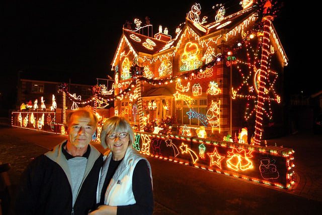 John Berry and his partner Gill Fletcher, show off their impressive collection of festive lights at their home in Normanton, December 2005.