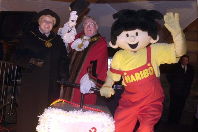 Mayor and Mayoress of Wakefield Councillor Robert Mitchell and wife Hilary join Hariboy of Haribo to officially switch on the Christmas lights in Pontefract in November 2002.