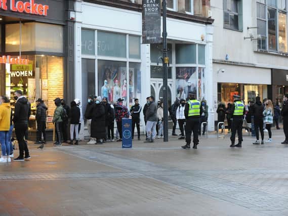 Shoppers queue for limited edition trainers at Foot Locker in Briggate.