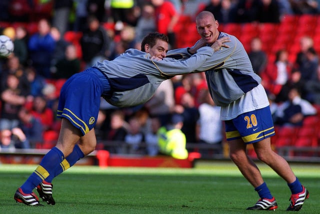Jonathan Woodgate and Seth Johnson share a joke during the warm-up at Old Trafford.