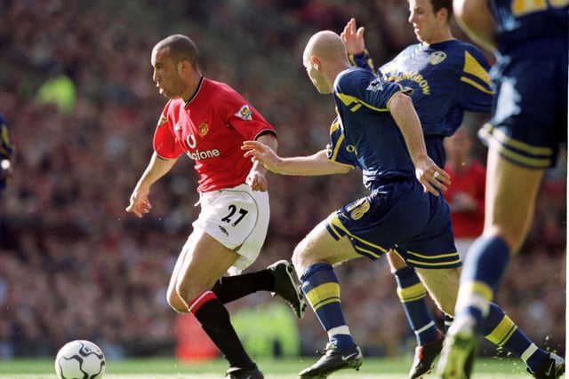Danny Mills hunts down Manchester United's Mikael Silvestre.