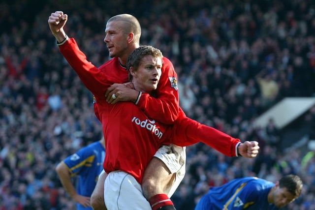 Ole Gunnar Solskjaer celebrates with David Beckham after equalising