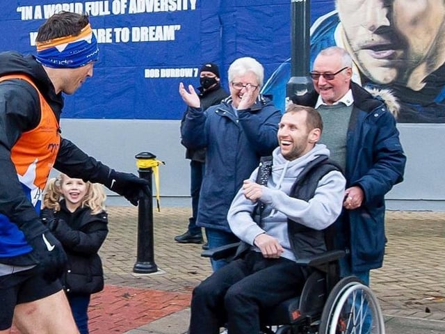 To donate please visit the Just Giving page here: https://www.justgiving.com/crowdfunding/sinfield-7-in-7 (Pictured is Rob Burrow greeting Kevin Sinfield during his marathon over the weekend.)