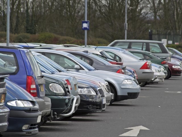 When using any designated space, a car is not considered ‘in’ the space if the wheels are over any lines and could be ticketed.